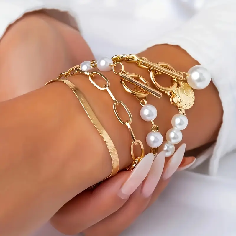 Elegantes 4-teiliges Armbandset in Gold – Schlange, Perlen & Glieder - Image 3